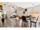 Bright living area showcasing tall ceilings, a staircase, modern furnishings, and sliding door access to the outdoors at 5674 Moccasin Point St, Las Vegas, NV 89148