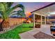 Serene backyard oasis with hot tub, fire pit, patio, lounge area, and well-kept synthetic grass at 6187 Novelty St, Las Vegas, NV 89148