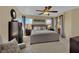 Neutral bedroom with multiple windows and ceiling fan at 6187 Novelty St, Las Vegas, NV 89148