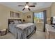 Cozy bedroom featuring a ceiling fan, neutral walls, and a comfortable queen-sized bed at 6187 Novelty St, Las Vegas, NV 89148