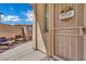 Inviting patio with seating area and secure gate, leading to the front door with welcome sign at 6187 Novelty St, Las Vegas, NV 89148
