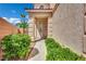 Charming front entryway with manicured landscaping and a secure screen door at 6187 Novelty St, Las Vegas, NV 89148