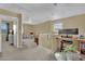 Upper level hallway with desk space, neutral colored carpet and access to bedrooms and bathrooms at 6187 Novelty St, Las Vegas, NV 89148