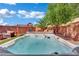 Enjoy the backyard oasis with a relaxing hot tub and comfortable seating area at 6187 Novelty St, Las Vegas, NV 89148