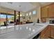 Bright kitchen featuring stainless steel appliances, tile countertops, and natural wood cabinets at 6187 Novelty St, Las Vegas, NV 89148