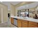 Kitchen area with tile flooring and stainless steel dishwasher at 6187 Novelty St, Las Vegas, NV 89148