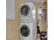 Laundry room area featuring stacked, front-loading washer and dryer at 6187 Novelty St, Las Vegas, NV 89148