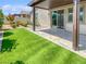 Backyard featuring artificial turf, a covered patio, and landscaping at 6312 Conlon St, North Las Vegas, NV 89081