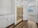 Bathroom showcasing tiled shower, granite countertop vanity, and modern fixtures at 6312 Conlon St, North Las Vegas, NV 89081