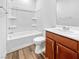 Bathroom showcasing a bathtub/shower combo and vanity with ample storage space at 6312 Conlon St, North Las Vegas, NV 89081