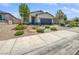 Charming single-story home featuring a two-car garage and a landscaped front yard at 6312 Conlon St, North Las Vegas, NV 89081