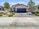Charming single-story home featuring a two-car garage and low-maintenance landscaping at 6312 Conlon St, North Las Vegas, NV 89081