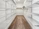 Walk-in closet with installed shelving for optimal storage and organization at 6312 Conlon St, North Las Vegas, NV 89081