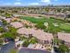 Aerial view showcasing the property's proximity to the golf course and neighborhood at 664 Peachy Canyon Cir # 103, Las Vegas, NV 89144