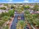 Aerial view of the community entrance with lush landscaping and secure gate at 664 Peachy Canyon Cir # 103, Las Vegas, NV 89144