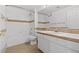 Bright bathroom featuring white tile, white vanity, and bronze fixtures at 664 Peachy Canyon Cir # 103, Las Vegas, NV 89144