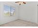 Bright bedroom with neutral carpet and large window offering natural light at 664 Peachy Canyon Cir # 103, Las Vegas, NV 89144
