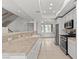 Bright, open kitchen with white cabinets, stainless steel appliances, and tile countertops at 664 Peachy Canyon Cir # 103, Las Vegas, NV 89144