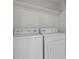 Laundry room with front load washer and dryer and storage at 664 Peachy Canyon Cir # 103, Las Vegas, NV 89144