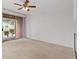 Light filled living space with patio access and views of the outside at 664 Peachy Canyon Cir # 103, Las Vegas, NV 89144