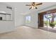 Bright living area with access to outdoor patio through sliding glass door at 664 Peachy Canyon Cir # 103, Las Vegas, NV 89144