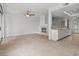 Open-concept living area with fireplace, tile floors, and views into the adjacent kitchen at 664 Peachy Canyon Cir # 103, Las Vegas, NV 89144