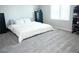Bright bedroom with neutral carpet, large window and ample space for furnishings at 7411 Sunray Point St, North Las Vegas, NV 89084