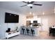 Bright, open living space featuring stainless steel appliances, a kitchen island and a ceiling fan at 7411 Sunray Point St, North Las Vegas, NV 89084