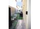 Side yard with artificial turf, seating, and grill; great for relaxing or entertaining at 7411 Sunray Point St, North Las Vegas, NV 89084