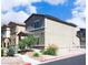 Street view of a two-story home with a covered entryway and low-maintenance desert landscaping at 7411 Sunray Point St, North Las Vegas, NV 89084
