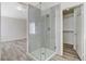Bathroom showcasing a glass-enclosed shower with neutral tile and updated fixtures at 7521 Reindeer Ct, Las Vegas, NV 89147