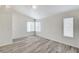 Bedroom featuring a vaulted ceiling and multiple windows at 7521 Reindeer Ct, Las Vegas, NV 89147