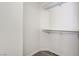 Walk-in closet with white shelving and wood-look flooring at 7521 Reindeer Ct, Las Vegas, NV 89147
