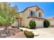 Inviting two-story home with a well-manicured lawn and a two-car garage, perfect for suburban living at 7521 Reindeer Ct, Las Vegas, NV 89147