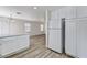 Bright kitchen featuring white cabinets and stainless steel refrigerator at 7521 Reindeer Ct, Las Vegas, NV 89147