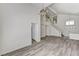 Bright living room boasts wood flooring, high ceilings, and an elegant chandelier at 7521 Reindeer Ct, Las Vegas, NV 89147