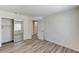 Spacious main bedroom featuring a closet, wood-look flooring, and an ensuite bathroom at 7521 Reindeer Ct, Las Vegas, NV 89147