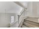 Staircase featuring wood stairs and white railing at 7521 Reindeer Ct, Las Vegas, NV 89147