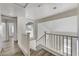 Staircase featuring wood stairs and white railing at 7521 Reindeer Ct, Las Vegas, NV 89147