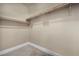 A well-organized walk-in closet with ample shelving and storage space for clothes and accessories at 7670 Frittata Ave, Las Vegas, NV 89113