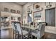 Elegant dining area features hardwood floors and modern light fixture at 7670 Frittata Ave, Las Vegas, NV 89113