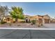 Charming single-story home boasts desert landscaping and attached two-car garage at 7670 Frittata Ave, Las Vegas, NV 89113