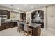 Modern kitchen boasts stainless steel appliances, granite countertops and a central island at 7670 Frittata Ave, Las Vegas, NV 89113
