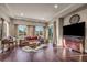 Open-concept living room boasts hardwood floors, recessed lighting and access to the backyard pool at 7670 Frittata Ave, Las Vegas, NV 89113