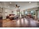 Spacious main bedroom suite features a sitting area, hardwood floors, recessed lighting and ample windows at 7670 Frittata Ave, Las Vegas, NV 89113