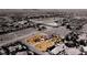 Aerial view showcasing the property's location, surrounded by desert landscape and neighborhood streets at 7720 W Agate Ave, Las Vegas, NV 89113