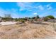 Image showing backyard, patio area, and a fence line with desert landscaping at 7720 W Agate Ave, Las Vegas, NV 89113