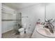 Clean bathroom featuring tiled floors, glass enclosed shower, toilet, and double sink with vanity at 7720 W Agate Ave, Las Vegas, NV 89113