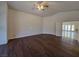 Hardwood bedroom floor with access to other room and bright, airy space at 7720 W Agate Ave, Las Vegas, NV 89113