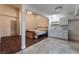 Studio apartment featuring a bedroom space with hardwood floors and a kitchen space with a breakfast bar at 7720 W Agate Ave, Las Vegas, NV 89113